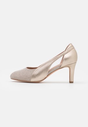 Beige and metallic gold women's mid-heel pump with pointed toe, cut-out side, and slim heel on white background.