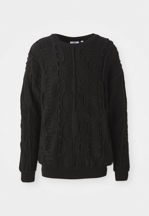 Pulover negru tricotat, cu un model texturat de cablu, guler rotund și manșete și tiv dantelate. Confeționat dintr-un material călduros.