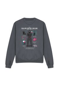 Gray sweatshirt featuring a central graphic of a hooded figure labeled "SUPERVISOR" and icons related to the "Squid Game" theme.