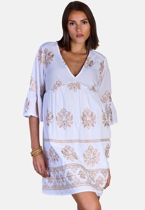 White dress with a deep V-neck and three-quarter bell sleeves. Features intricate bronze floral embroidery and a relaxed fit.
