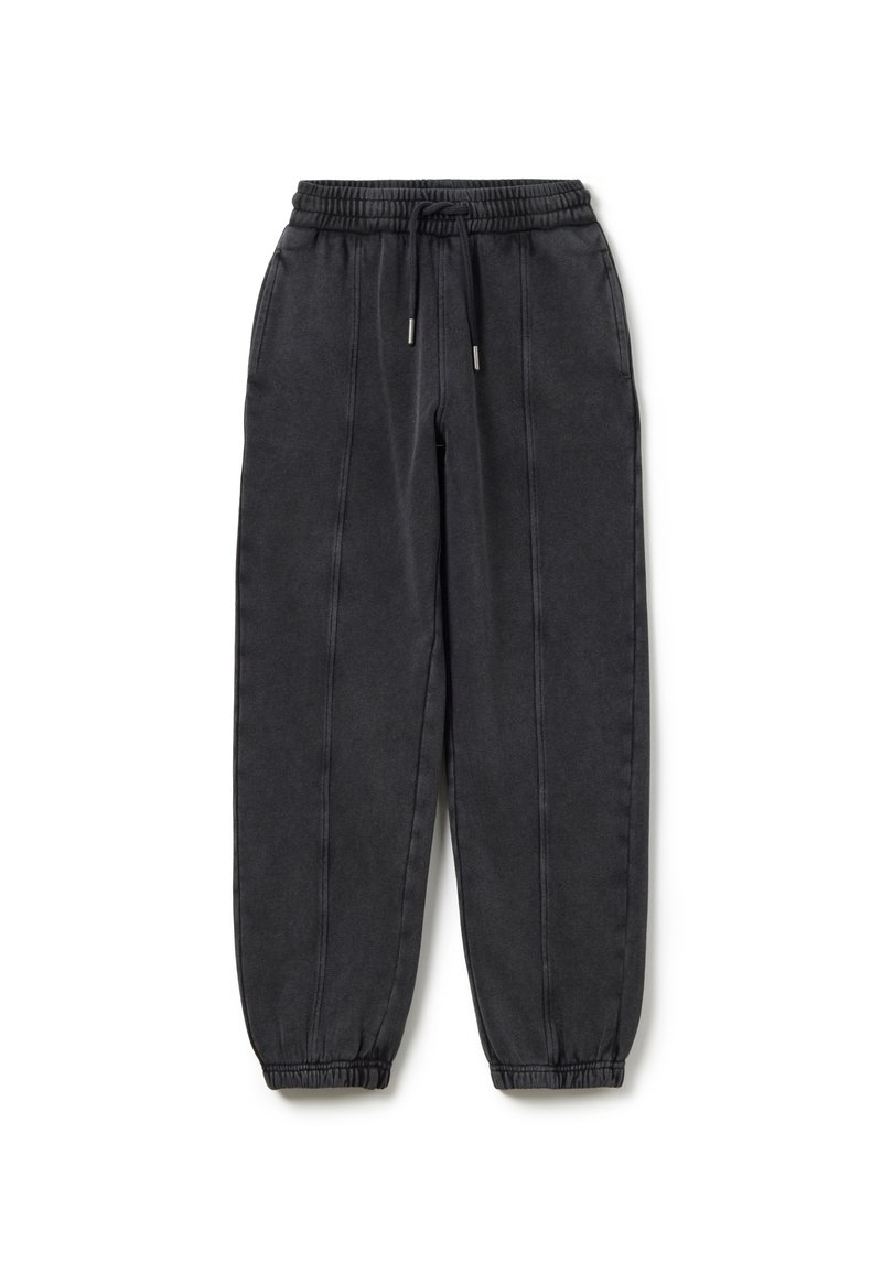 Schwarze tapered Jogginghosen mit elastischem Bund, Kordelzug und Bündchen an den Knöcheln; mit dezenten Seitennähten und weichem Stofftextil.