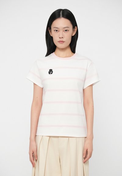 Short-sleeve, light pink and white striped cotton t-shirt with a round neckline and a black and white embroidered character on the chest.