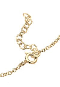 Bracciale in oro con anelli ovali intrecciati, dotato di clasp rotondo e catena di estensione per lunghezza regolabile. Texture liscia e finitura lucida.