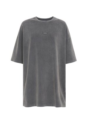 Übergroßes T-Shirt in Anthrazitgrau aus weichem Baumwollstoff. Hat einen Rundhalsausschnitt und kurze Ärmel. Beinhaltet ein kleines Markenetikett auf der Vorderseite.