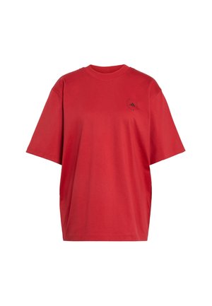 T-shirt rossa oversize a maniche corte con scollo rotondo e piccolo logo Adidas nero sul petto superiore sinistro.