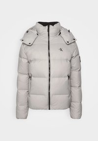 Lichtgrijze pufferjack met ritssluiting aan de voorkant, hoge kraag, afneembare capuchon, zijzakken met ritssluiting en klein "ck"-logo op de borst.