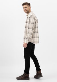 Wojas Šněrovací kotníkové boty - brązowy