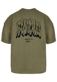 Olive green cotton t-shirt featuring large black graffiti-style text on the back. Simple crew neck and relaxed fit design.