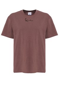 Brązowa bawełniana koszulka z krótkim rękawem i okrągłym dekoltem. Na przodzie haftowane logo w kolorze czarnym. Gładka tekstura, luźny krój.