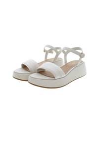 Bílé wedge sandály s hladkým syntetickým svrškem a tkaným popruhem. Mají kotníkové popruhy se zlatou sponou. Gumová podrážka pro lepší přilnavost.