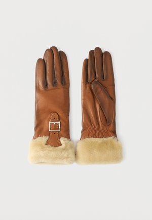 Brown leather gloves with a fur cuff, featuring a decorative buckle and stitching detail. Smooth texture with elongated fingers and snug fit.