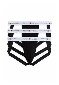 Jockstrap nero con tre cinturini bianchi elastici brandizzati "Tommy Hilfiger" e ulteriori dettagli in elastico nero.