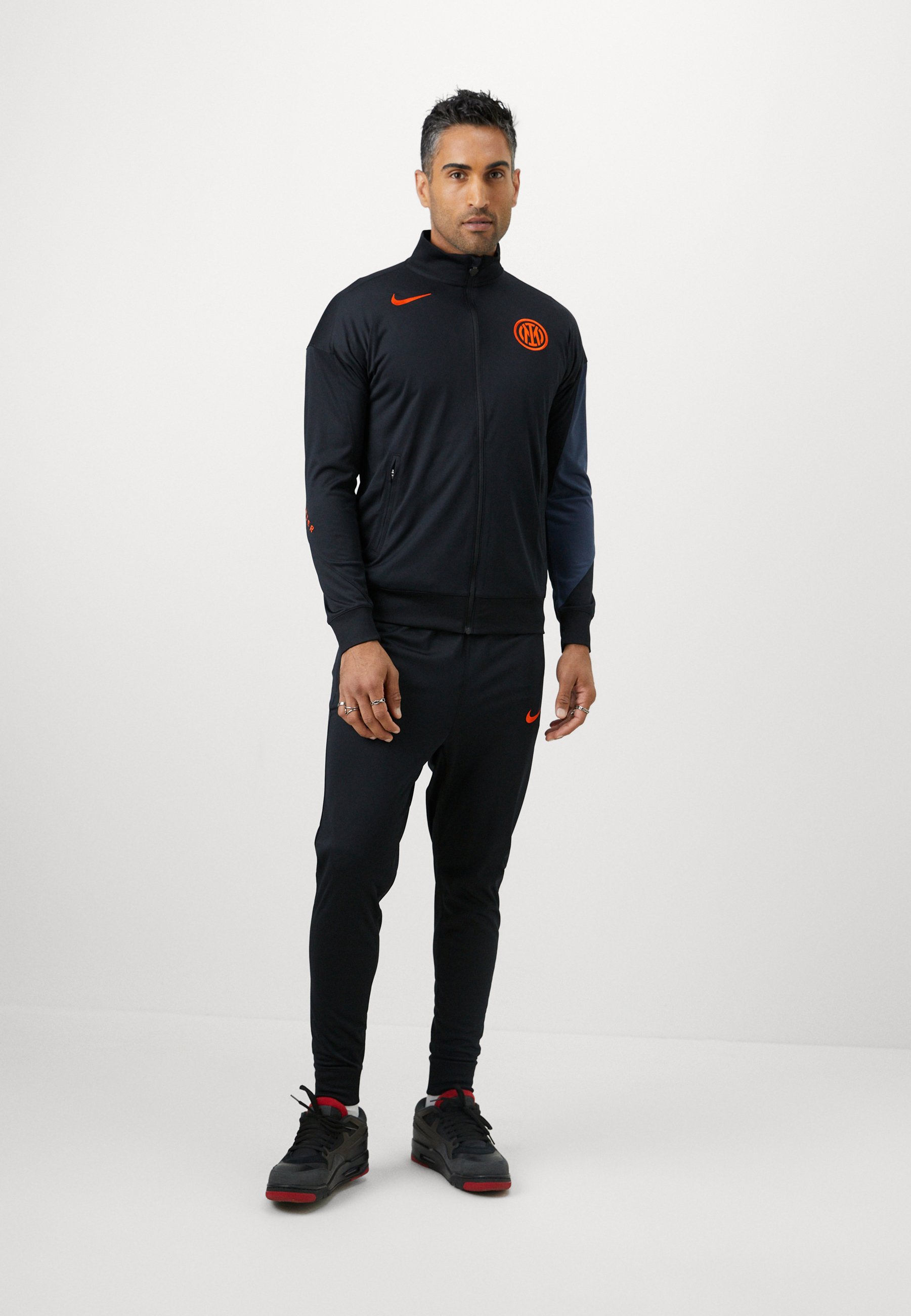 orange tracksuit nike