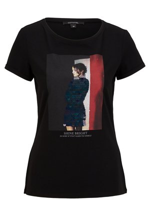 T-shirt noir à manches courtes avec un graphisme d'une femme en robe à sequins de profil et le texte "SHINE BRIGHT Do more of what makes you sparkle."