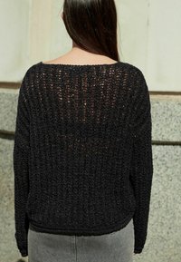 Next Stickad tröja - black