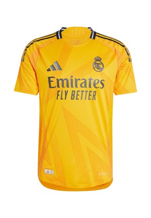 Camiseta amarilla de Adidas con mangas cortas, que presenta un patrón de zigzag, acentos negros y el logo "Emirates Fly Better" en el frente.