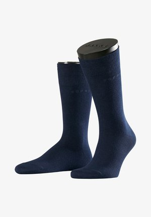 Dunkelblaue Baumwollsocken mit glatter Textur, geripptem Bündchen und dezentem 'Esprit'-Logo. Entworfen für Komfort und Langlebigkeit.