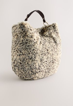 Faux fur bag with a beige and brown spotted pattern, featuring a rounded shape and dark leather strap with gold hardware accents.
