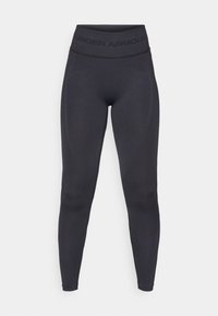 Melni legingi ar augstu elastīgu jostasvietu, uz kuras ir teksts "UNDER ARMOUR". Gluda tekstūra ar smalkiem raksta akcentiem gar kājām.