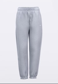 Sive trenirke od lagano teksturiranog tkanja, s elastičnim pojasom i vrpcom za zatezanje te suženim manžetama. Nike logo na lijevom bedr.
