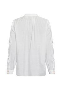 Weißes Langarmshirt mit Spitzenakzenten an den Ärmeln, weichem Stoff, Knopfmanschetten und einem leicht gerafften Rückendesign.