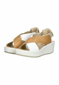 Hnědo-bílé kožené klínové sandály s křížovými popruhy, otevřenou špičkou, elastickým páskem na patě a zdrsněnou gumovou podrážkou pro lepší přilnavost.