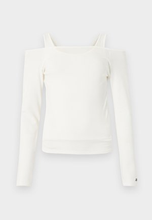 Bela dolga majica z dolgimi rokavi in odprtimi ramenčki s tankimi naramnicami ter ravnim izrezom, prikazana na svetli podlagi.