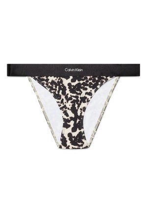 Tanga de estampado de leopardo en blanco y negro con una cinturilla elástica negra que presenta el logo "Calvin Klein". Tela suave, diseño de cobertura mínima.