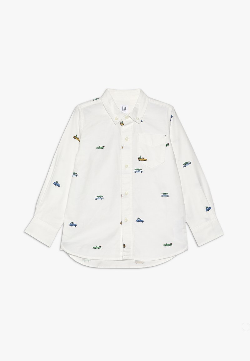 Chemise blanche à manches longues avec boutons, col, poche poitrine et petits motifs colorés de voitures dispersés sur le tissu.
