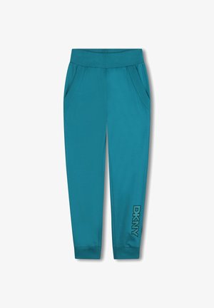 Pantalons de survêtement teal avec une taille côtelée, des poches latérales et un logo "DKNY" noir sur la jambe inférieure. Tissu doux et extensible.