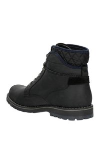 Black leather ankle boots with a textured quilted collar, grey laces, and a rugged sole, featuring contrasting stitching and a suede accent.