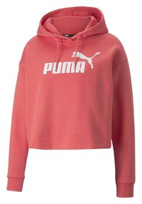 Felpa corta corallo realizzata in tessuto morbido. Presenta un cappuccio con coulisse e una grafica del logo Puma bianco sul petto. Maniche lunghe con polsini a costine.