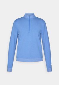 Pullover blu chiaro realizzato in un morbido tessuto testurizzato. Presenta un colletto con zip a un quarto e maniche lunghe con polsini aderenti. Logo Nike sulla manica.