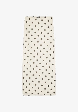 Kremowy prostokątny szalik z równomiernie rozmieszczonymi czarnymi groszkami na jednolitym białym tle.