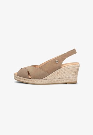 Sandalia cuña de ante beige con tiras cruzadas, punta abierta, tira trasera y suela de plataforma de cuerda trenzada.