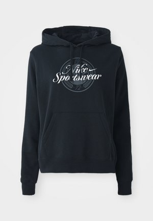 Black hoodie made from cotton blend fabric, featuring a front kangaroo pocket, drawstring hood, and a circular graphic with “Nike Sportswear” text.