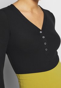 Nike Performance Justaucorps - black