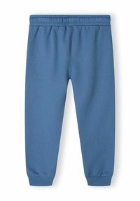 Blå joggingbyxor med elastisk midja, avsmalnande mudd och en mjuk textur, designade för komfort och rörelsefrihet.