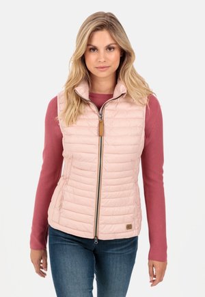 Light pink, quilted vest with a high collar and front zipper, paired with a long-sleeve red top. Fabric has a smooth texture and soft finish.
