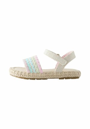 Sandale beige pour enfant avec une semelle tissée, une bride ondulée pastel rose, bleue et crème, et une bride réglable à la cheville.