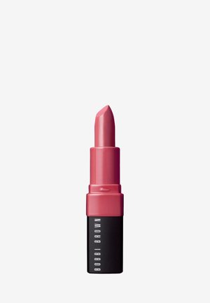 Lipstick in een ronde tube, met een zachte roze tint, glanzende afwerking, een matte zwarte basis en een heldere gravure van "BOBBI BROWN."