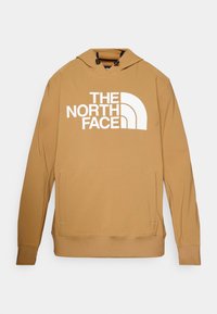 Mikina s kapucňou v svetlo hnedej látke s predným klokankovým vreckom a bielym logom "THE NORTH FACE"; má šnúrku na kapucni.