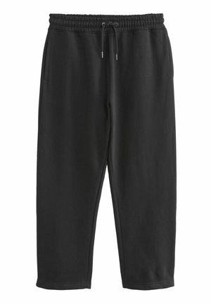 Pantaloni della tuta neri realizzati in tessuto morbido e stretch. Presentano un elastico in vita con cordino, tasche laterali e gambe affusolate.