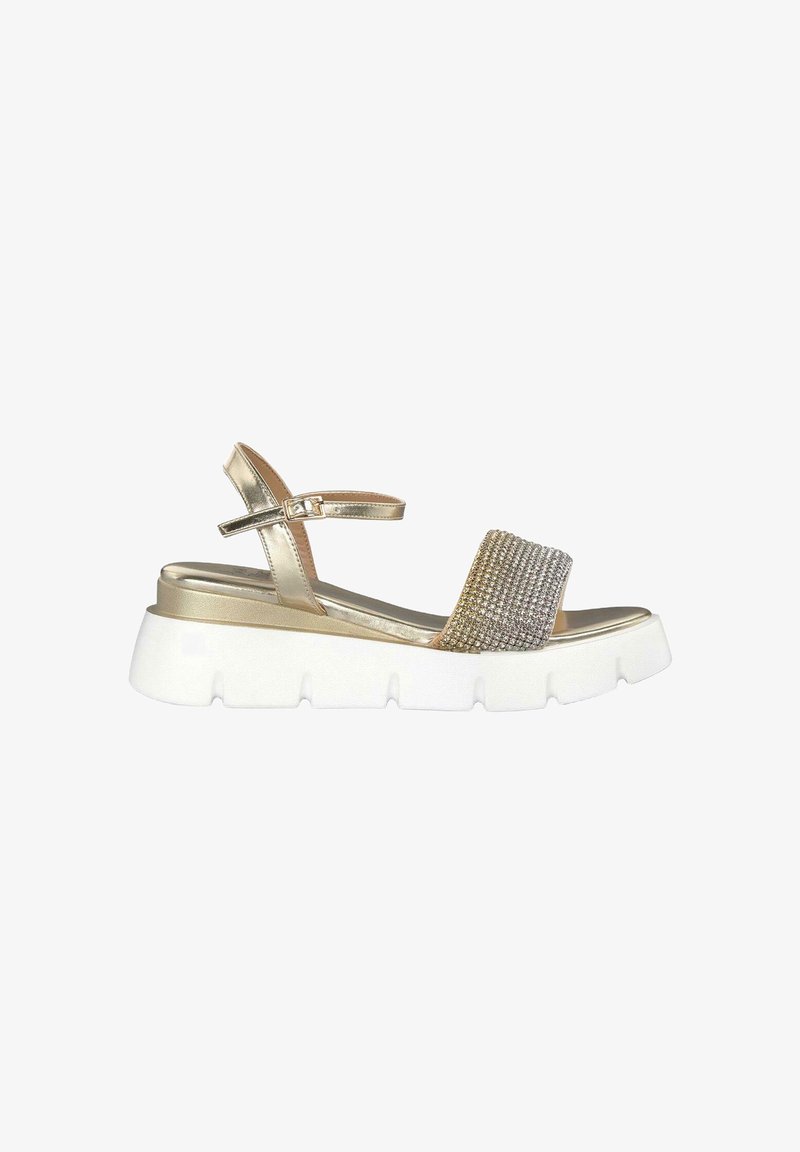 Gold metallic sandals with a textured rhinestone band, adjustable ankle strap, and a thick white platform sole for support.