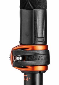 Black and orange adjustable trekking pole lock mechanism with a textured grip and visible height measurement markings. Leki branding is present.