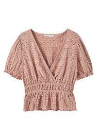 Rosa Bluse mit tiefem V-Ausschnitt, kurzen Puffärmeln, elastischem Taillenbund und durchgehendem Lochmuster. Leichter Stoff mit Volant-Saum.