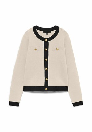 Beige cardigan met een zwarte ribbelkraag en manchetten, voorzien van twee klepzakken en gouden knopen aan de voorkant. Zachte gebreide textuur.