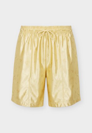 Skinnende gullfargede shorts til knærne med elastisk midjebånd, snøring foran, subtilt preget mønster og trykknapper langs sidene.