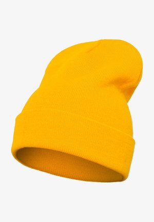 Žlutý pletený kulich s žebrovanou strukturou a ohrnutým lemem, vyrobený z měkkého a teplého materiálu vhodného pro chladné počasí.