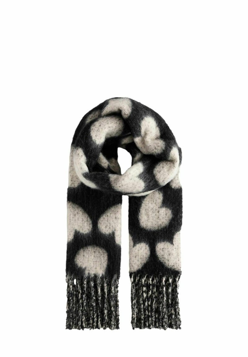Écharpe noire et crème à motifs en tissu doux et texturé, avec un motif en forme de cœur et des bords frangés pour plus de détails.